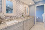The remodeled, luxury master bathroom provides guests with a spa-like experience that encourages relaxation and rejuvenation